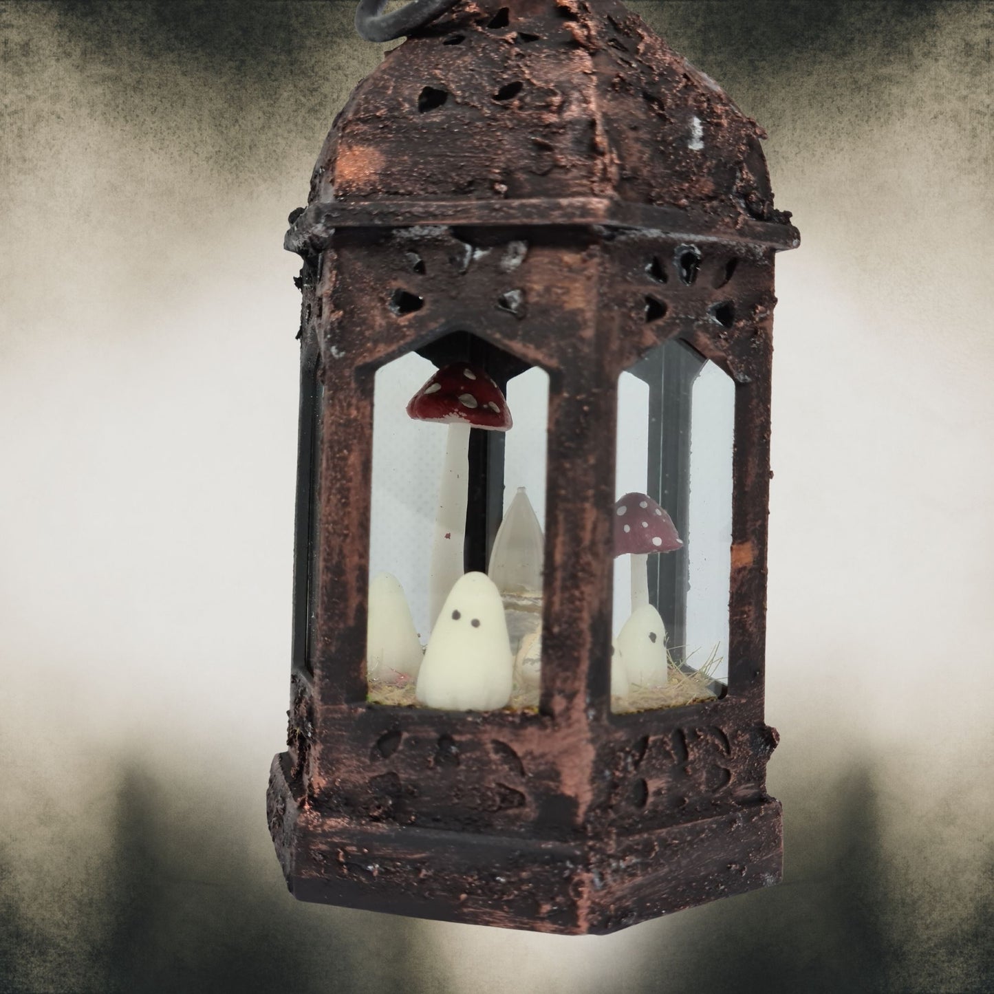 Bronze handmade ghost lantern with red mushrooms – gothic Halloween home decoration.