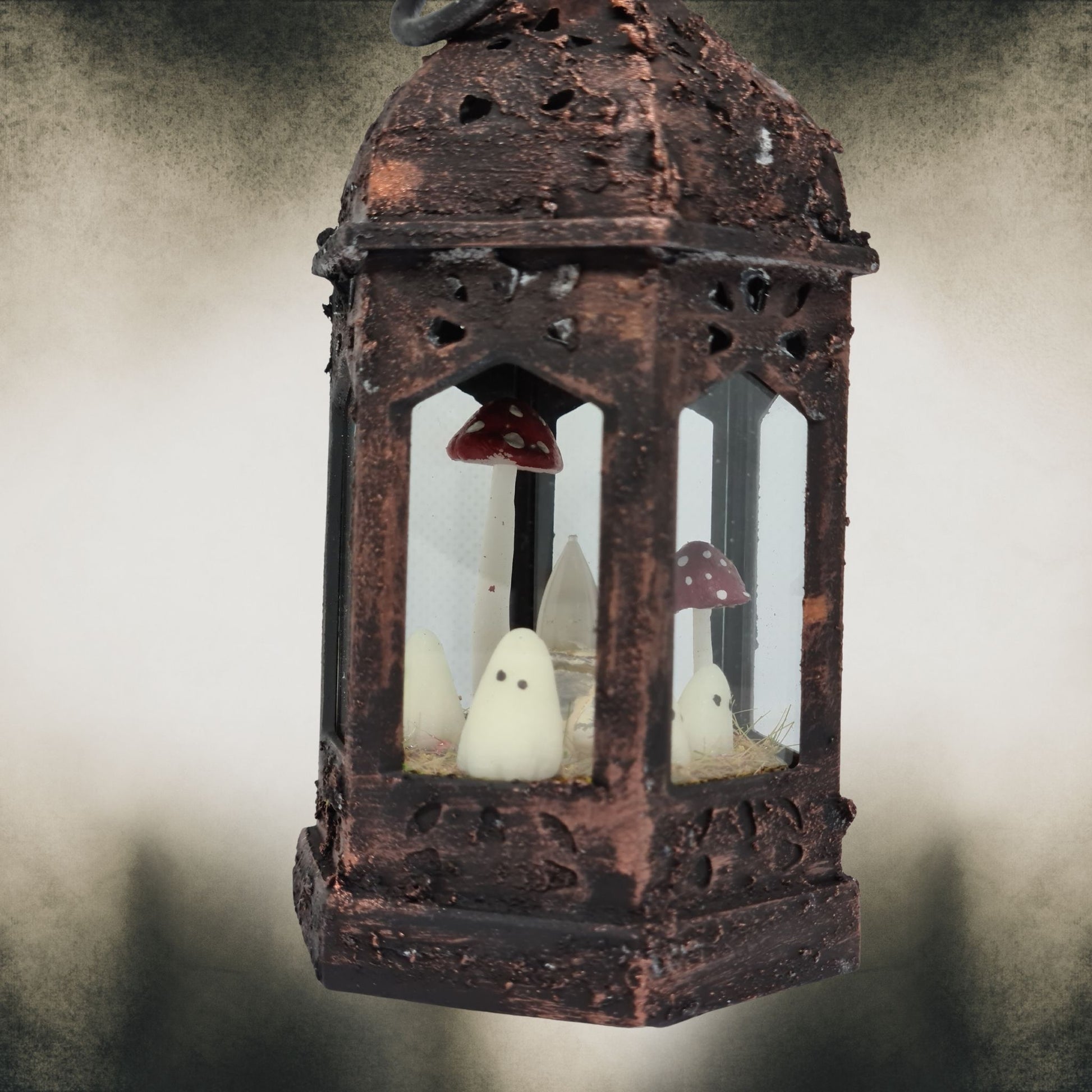 Bronze handmade ghost lantern with red mushrooms – gothic Halloween home decoration.