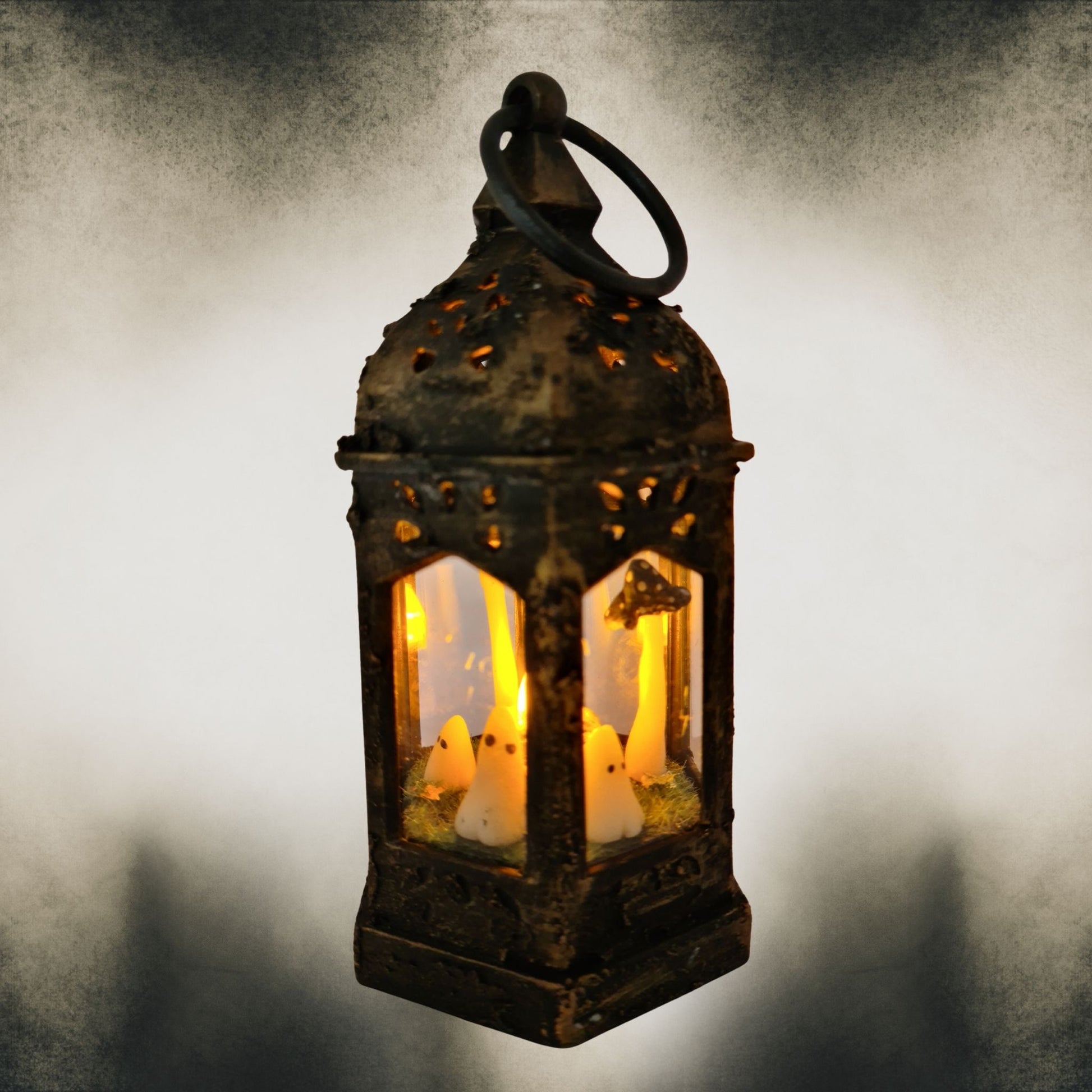 Gold dry-brushed handmade ghost lantern glowing with black mushrooms – gothic Halloween décor.
