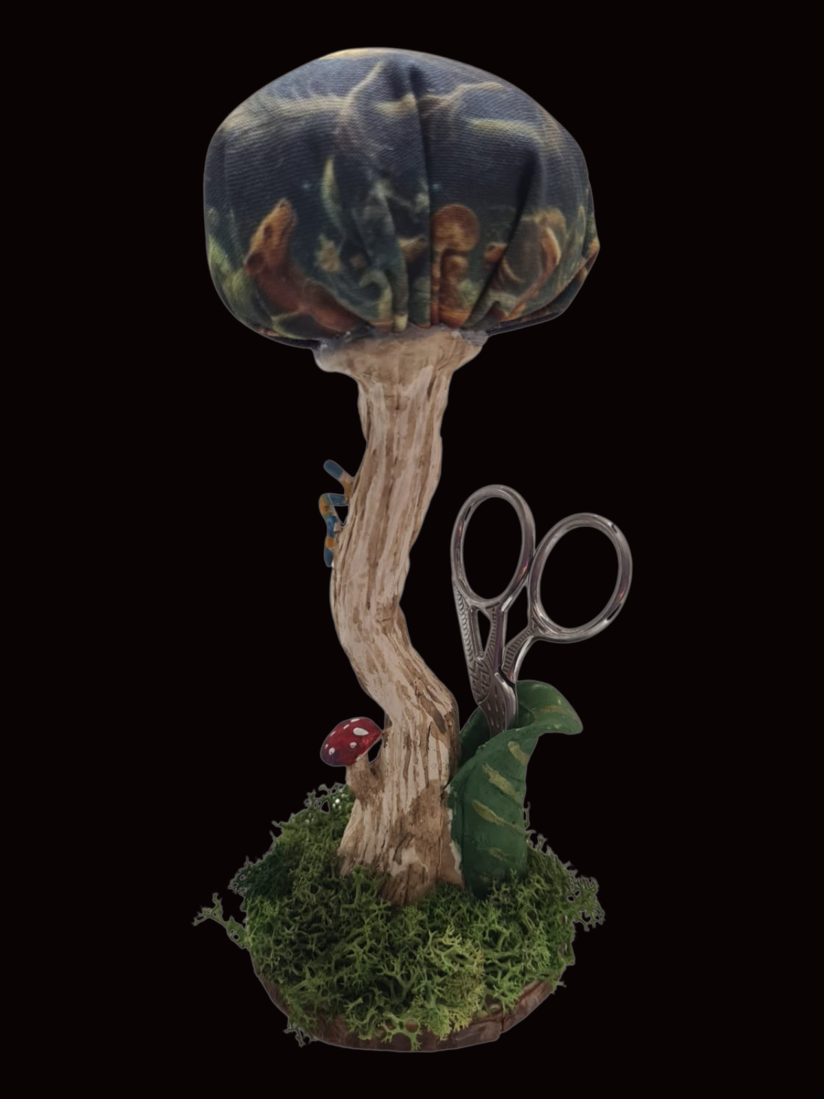 Handmade shroom pin cushion in Dragon Moon Chinoiserie fabric with sewing scissors.