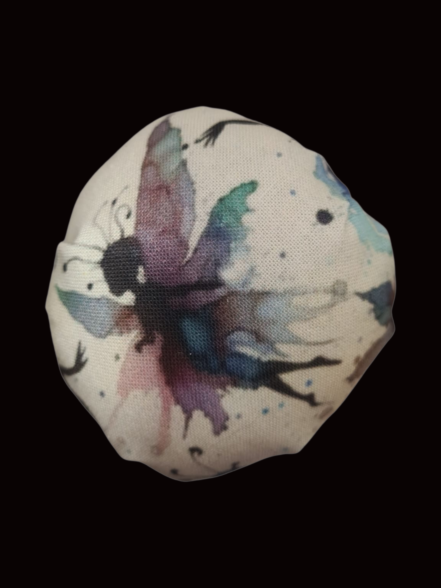 Macro close-up of the Fairy Friends fabric pattern used on a handmade shroom pin cushion.