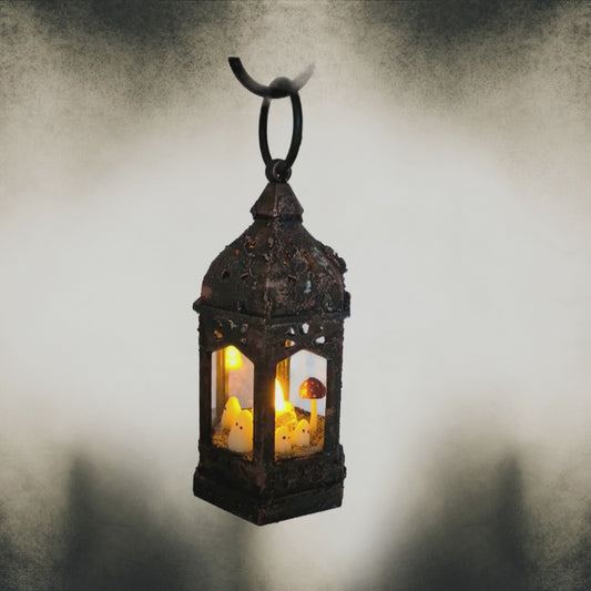 Short video of handmade ghost lantern glowing with red mushrooms and bronze shimmer – gothic Halloween décor.