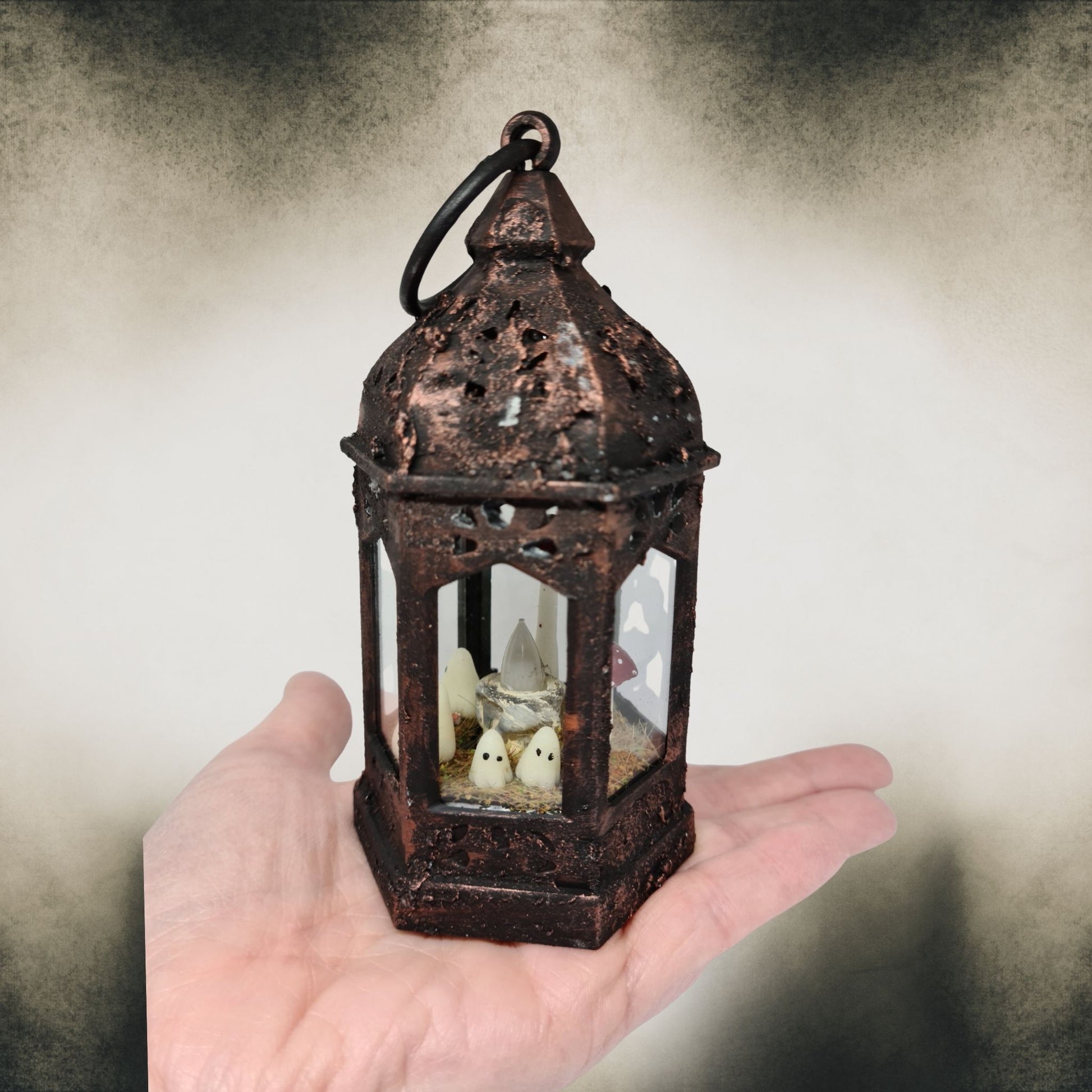 Handmade ghost lantern shown in hand for scale – spooky gothic Halloween home décor.